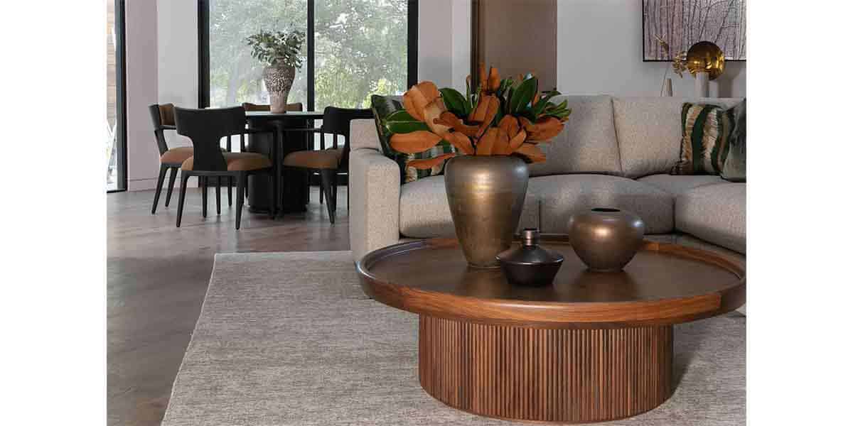 Contemporary living room with sofa, coffee table, and decorative vases.