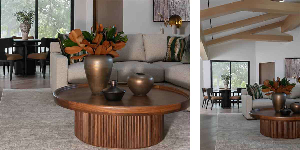 Modern living room with stylish decor, large windows, and a cozy seating area.