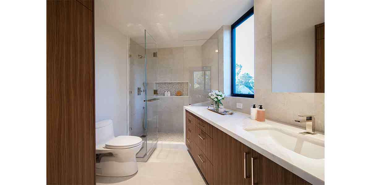 Contemporary bathroom featuring a large window, minimalist decor, and modern fixtures.