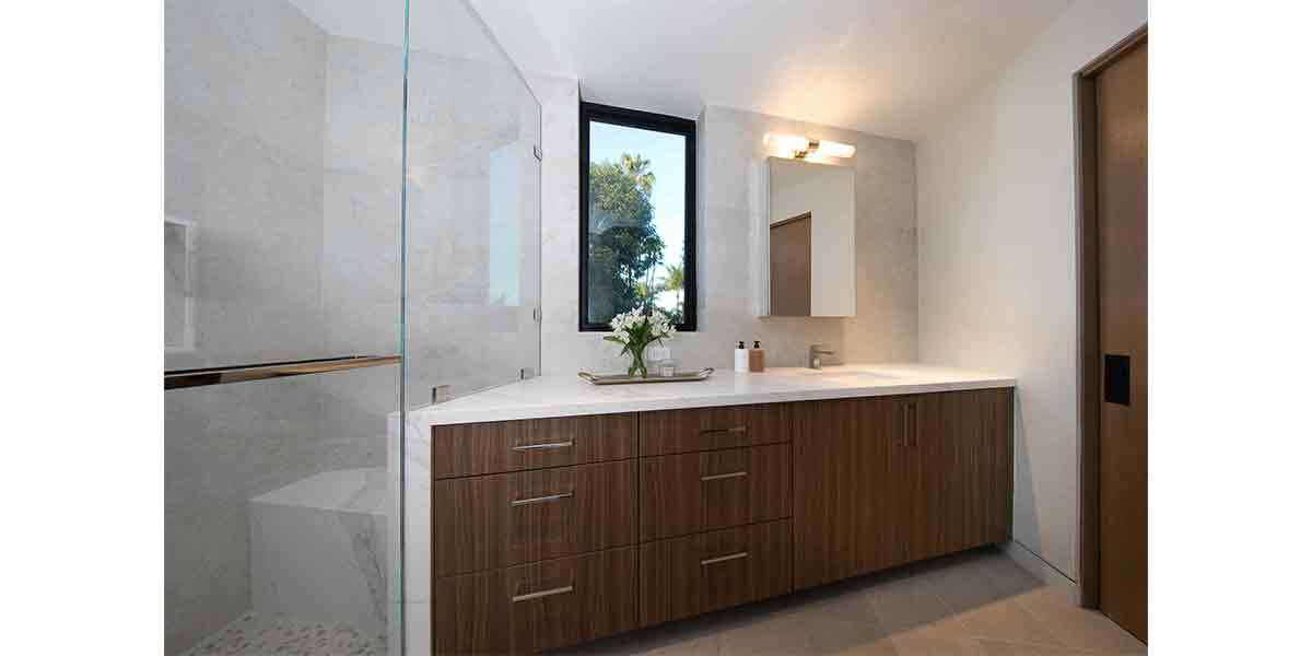 Contemporary bathroom vanity with sleek wood cabinetry and minimalist design.