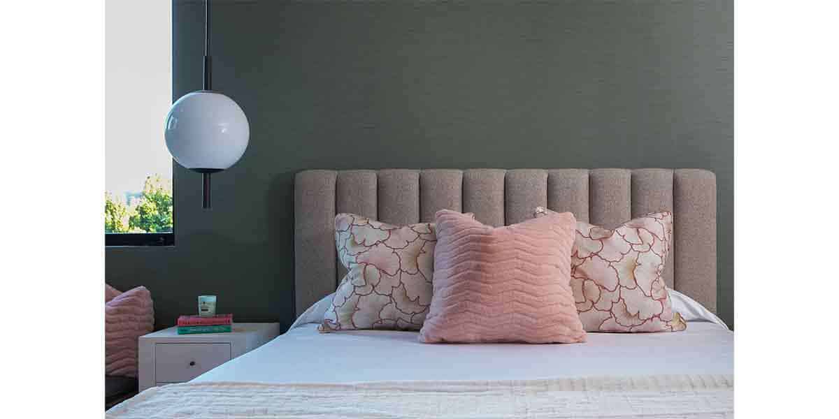 Luxurious bedroom with upholstered headboard, soft pillows, and contemporary style for a cozy, styli.