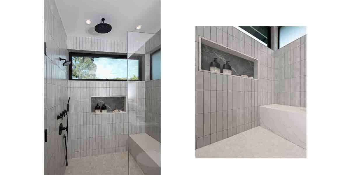 Bathroom with gray tiled walls, built-in niche, and sleek shower area.