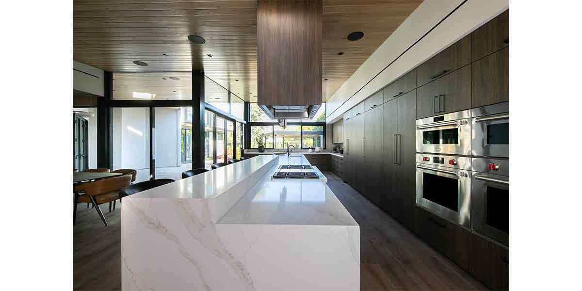 Modern kitchen with sleek cabinetry and a large island for cooking and entertaining.