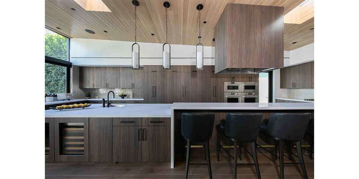 Modern minimalist kitchen with wood accents and sleek design elements.