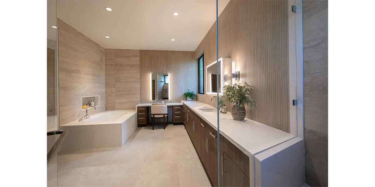 Modern bathroom with neutral tones and elegant fixtures.