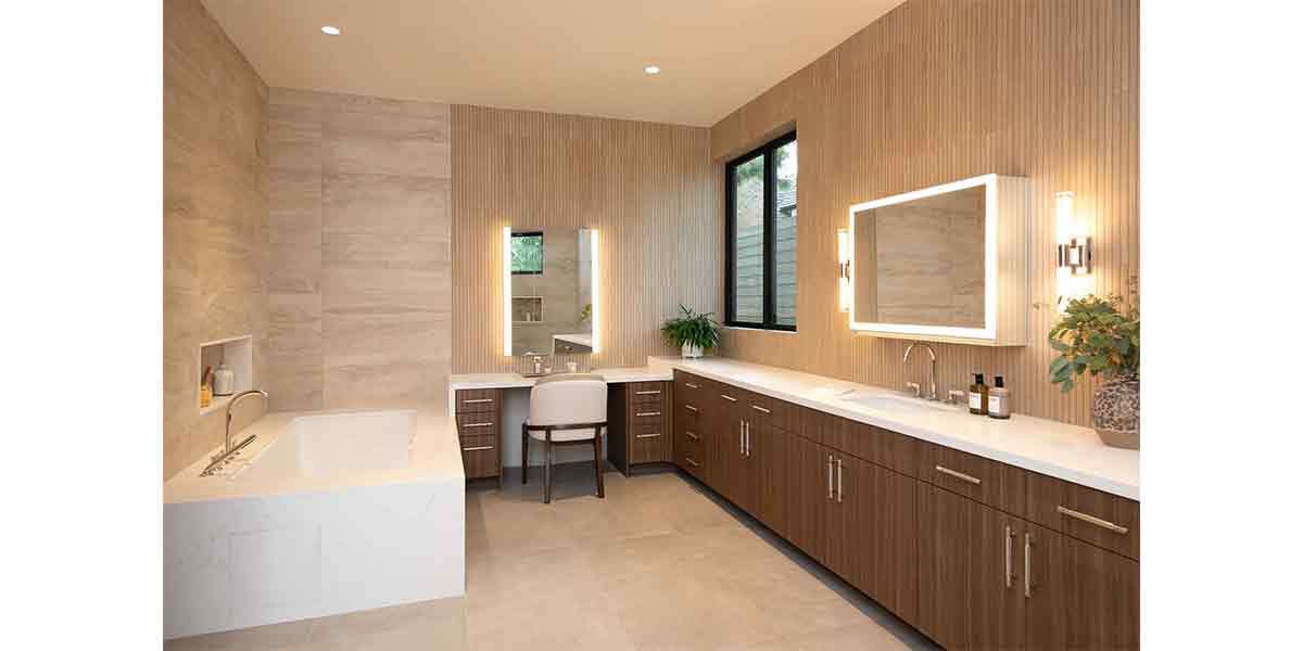 Contemporary bathroom design with wood cabinets and modern lighting fixtures.
