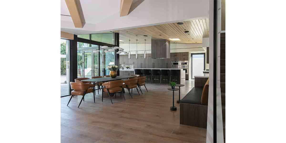 Open-concept kitchen and dining space featuring modern appliances and stylish decor.